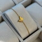 Gourmette papillon dore 500