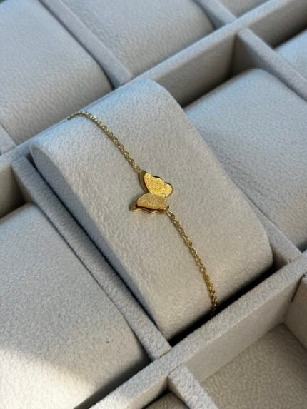 Gourmette papillon dore 500